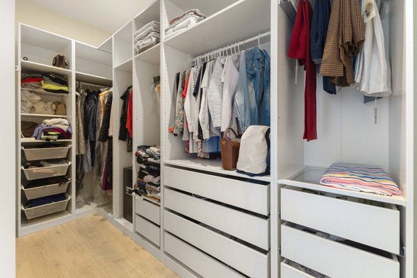2135 West Cermak Road, Unit 3S Chicago, IL 60608 - Photo 12 of 14 a view of walk in closet with clothes and shoes