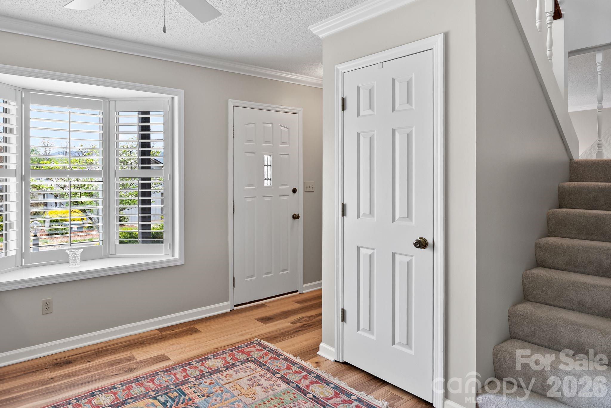 108 Kyfields Weaverville, NC 28787 - Photo 11 of 32 a view of a bedroom with furniture and window