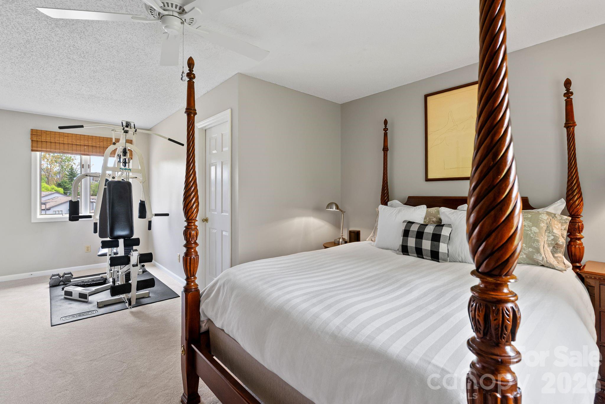 108 Kyfields Weaverville, NC 28787 - Photo 13 of 32 a bedroom with a bed and a flat screen tv
