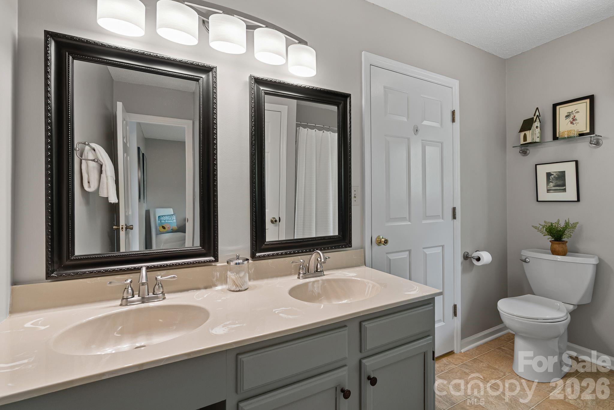108 Kyfields Weaverville, NC 28787 - Photo 14 of 32 a bathroom with a toilet sink and mirror