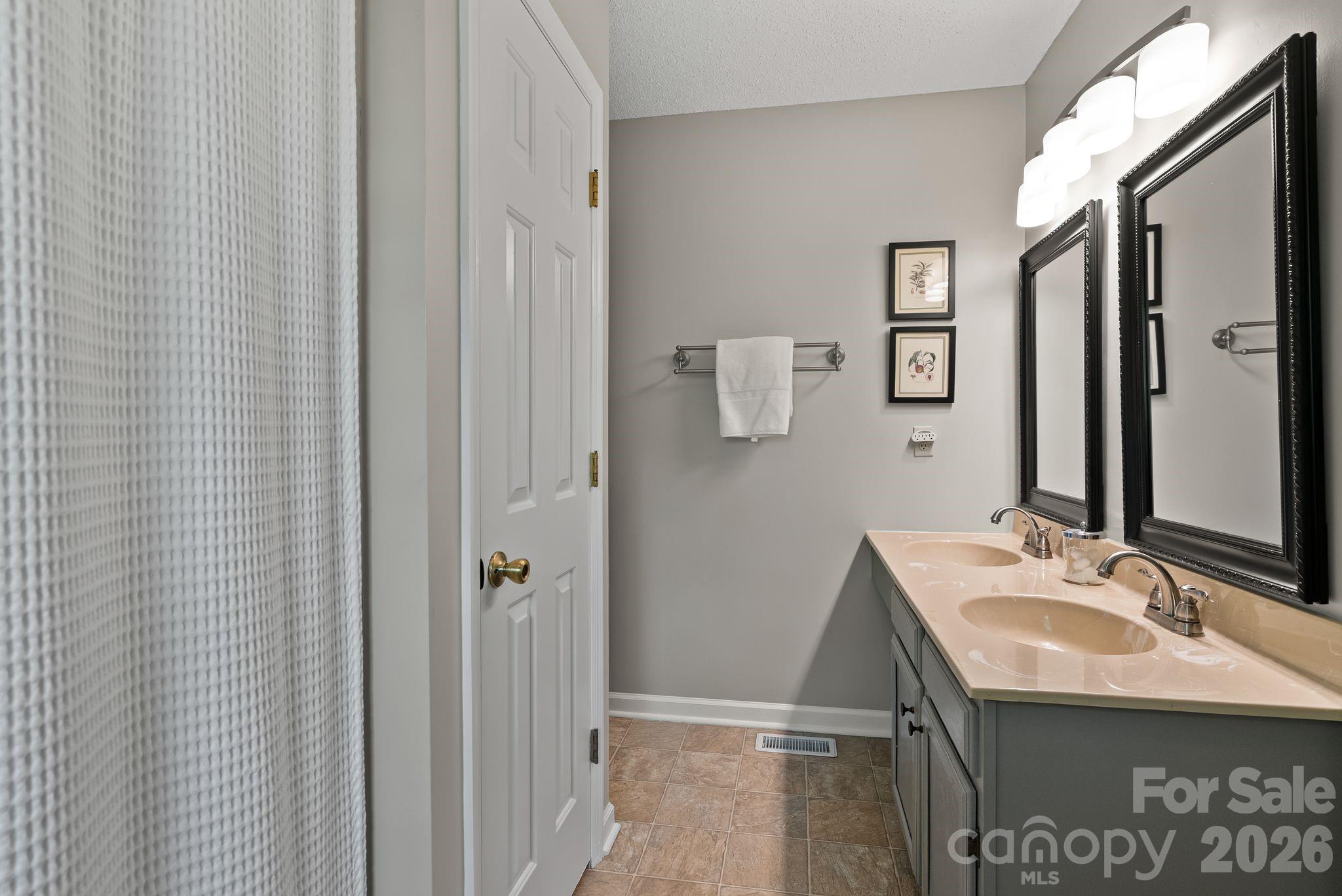 108 Kyfields Weaverville, NC 28787 - Photo 17 of 32 a bathroom with a sink and a mirror