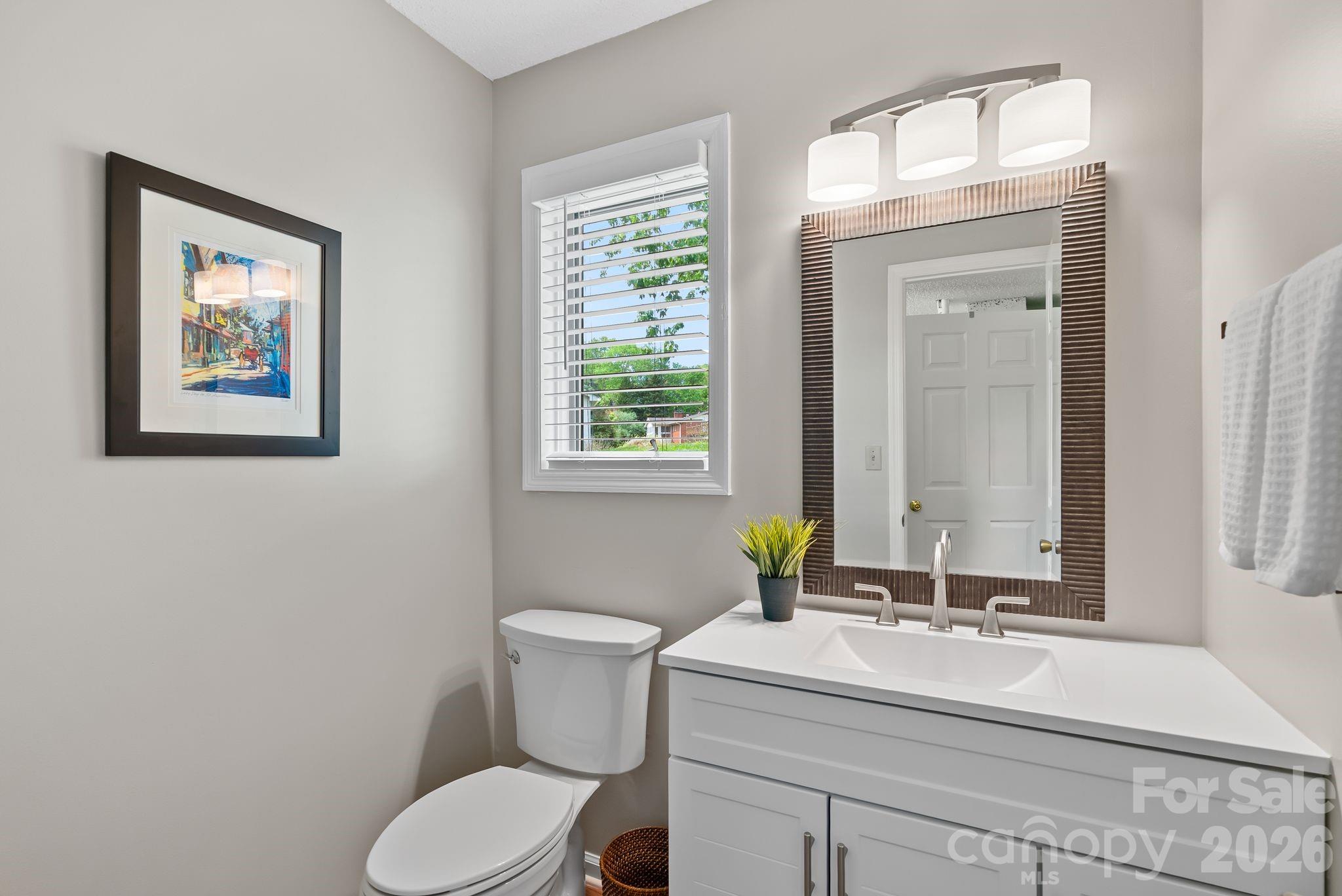 108 Kyfields Weaverville, NC 28787 - Photo 22 of 32 a bathroom with a toilet sink and mirror