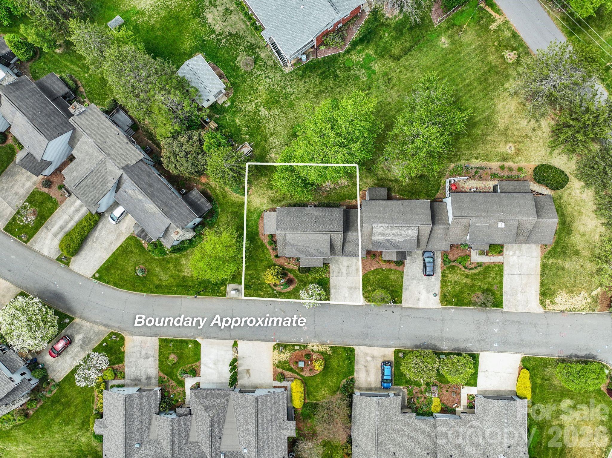 108 Kyfields Weaverville, NC 28787 - Photo 25 of 32 an aerial view of a house with a garden