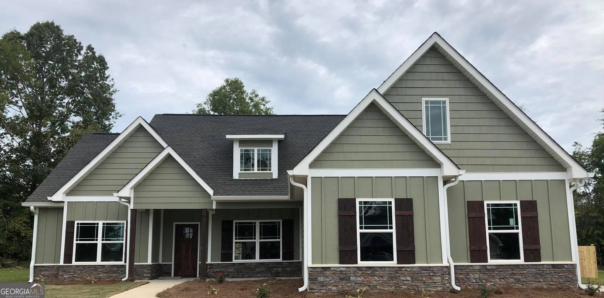 front view of a house with a small yard