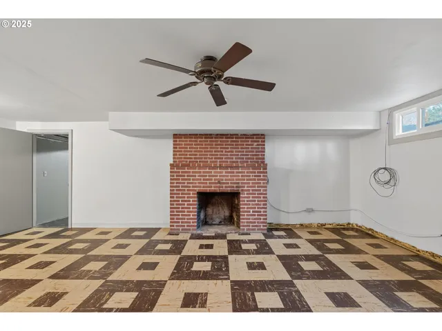 a bedroom with a bed and a fireplace