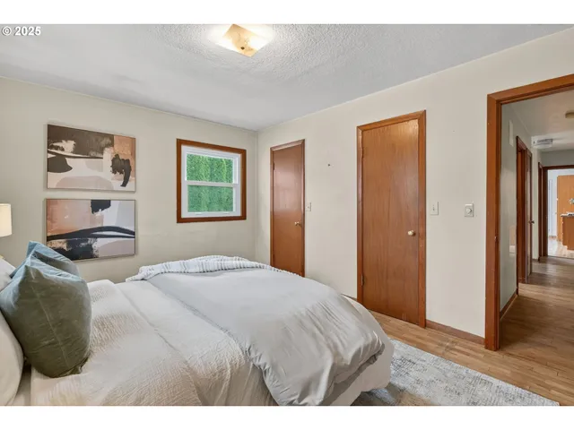 a bedroom with a bed and a cabinets