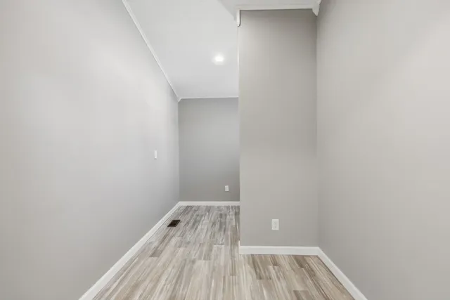 a view of wooden floor in a bathroom