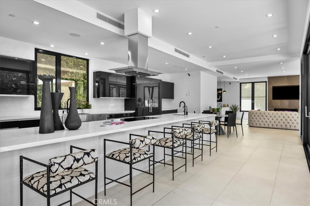 1210 Morningside Way Venice, CA 90291 - Photo 12 of 61 a kitchen with stainless steel appliances lots of white furniture a refrigerator and a stove