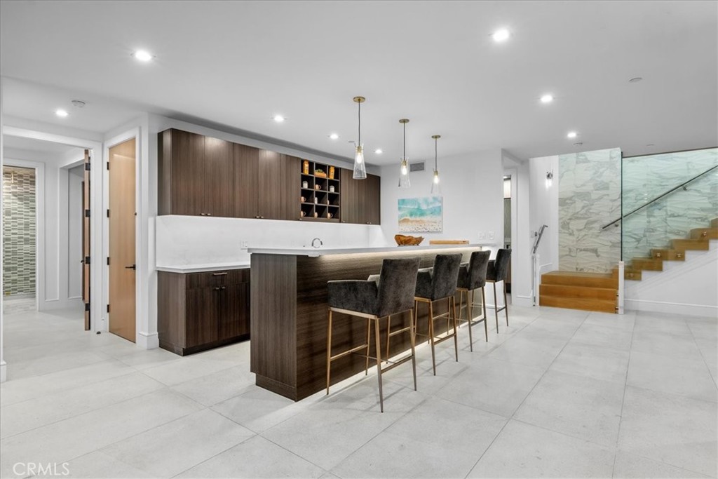 1210 Morningside Way Venice, CA 90291 - Photo 38 of 61 a kitchen with stainless steel appliances kitchen island granite countertop a refrigerator and a sink