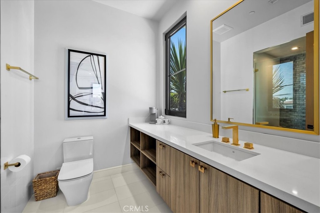 1210 Morningside Way Venice, CA 90291 - Photo 50 of 61 a bathroom with a sink a toilet and mirror