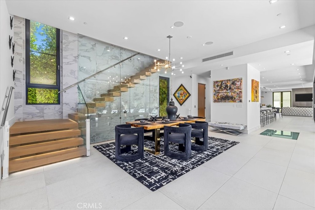 1210 Morningside Way Venice, CA 90291 - Photo 10 of 61 a living room with couch a dining table and a chandelier