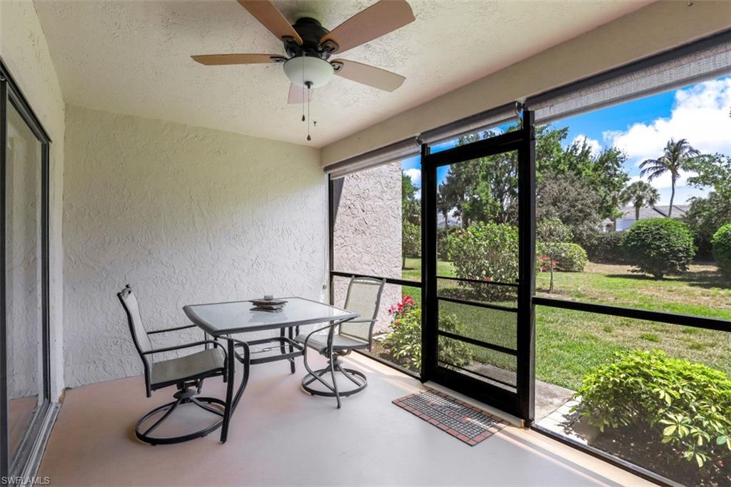 1782 Imperial Golf Course Boulevard, Unit C104 Naples, FL 34110 - Photo 22 of 34 a view of a chairs and table in a room