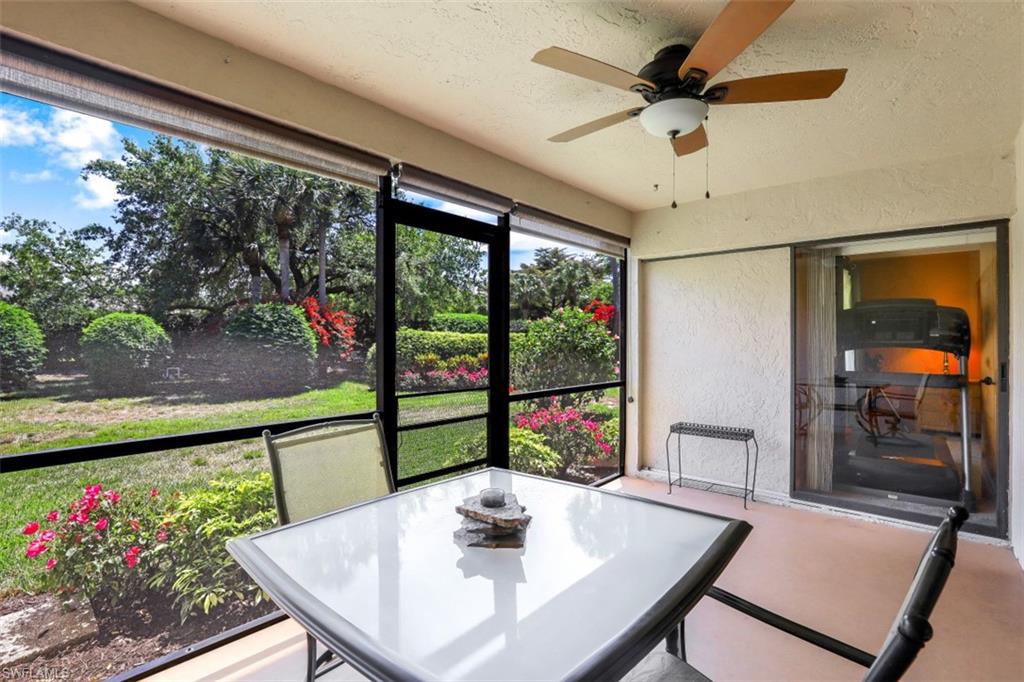 1782 Imperial Golf Course Boulevard, Unit C104 Naples, FL 34110 - Photo 23 of 34 a view of a dining room with furniture window and outside view