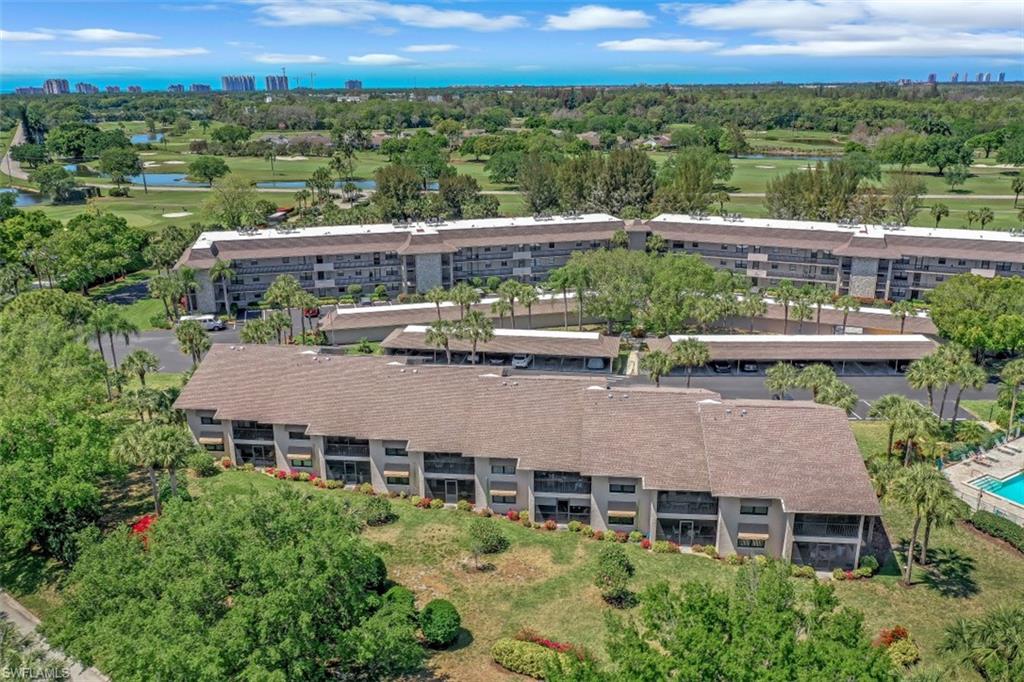 1782 Imperial Golf Course Boulevard, Unit C104 Naples, FL 34110 - Photo 34 of 34 an aerial view of a house with a yard