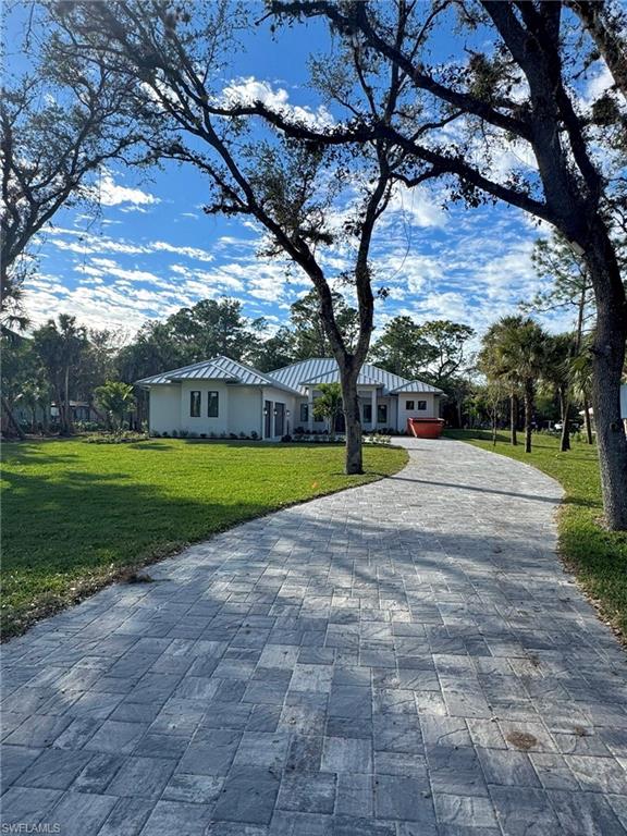1109 15th Street Southwest Naples, FL 34117 - Photo 1 of 4 a view of a park with large trees