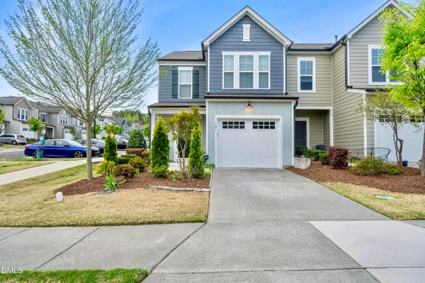 a patio with a table and chairs