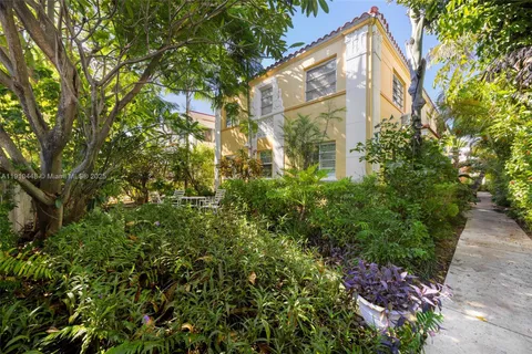 a view of a house with a tree