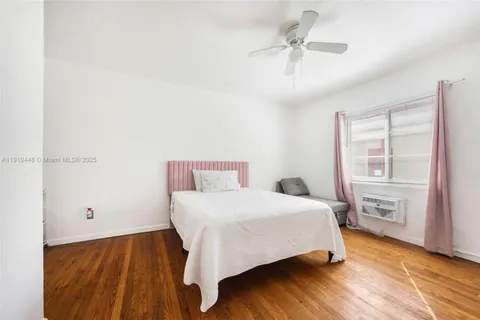 a bedroom with a bed and a table with closet