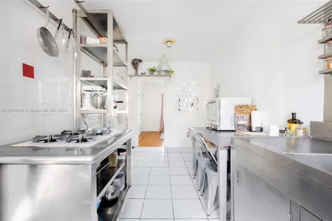 a kitchen with stainless steel appliances granite countertop a stove and a sink