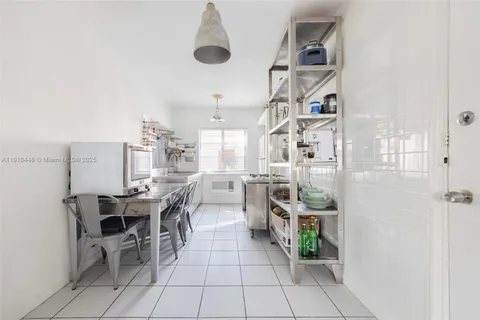 a view of a dining room with furniture and a window