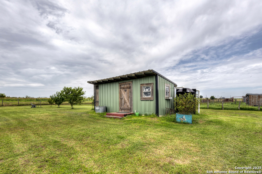 4190 Atkins Road Salado, TX 76571 - Photo 12 of 49 a backyard of a house with lots of green space and fence
