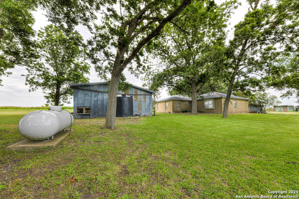 4190 Atkins Road Salado, TX 76571 - Photo 15 of 49 a backyard of a house with table and chairs
