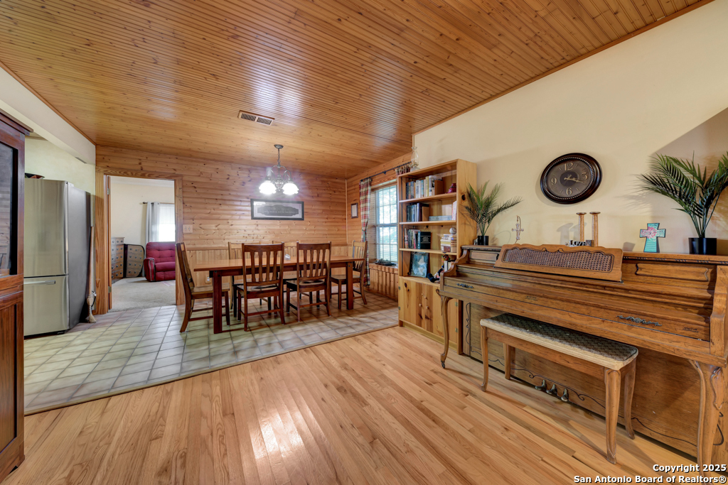 4190 Atkins Road Salado, TX 76571 - Photo 3 of 49 a room with lots of wooden furniture and a large window