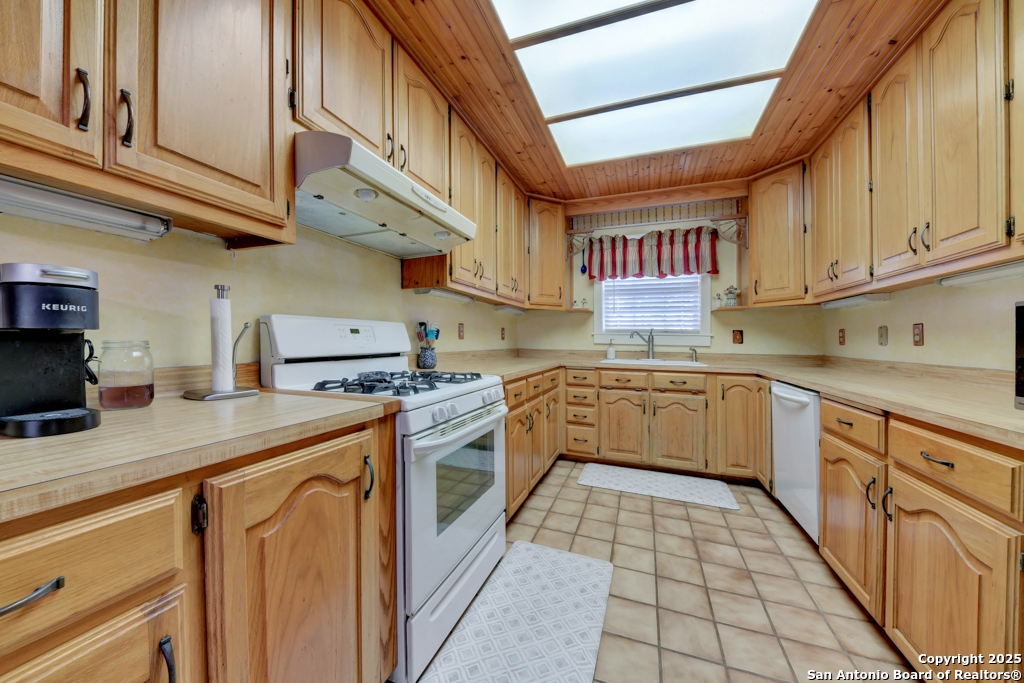 4190 Atkins Road Salado, TX 76571 - Photo 5 of 49 a kitchen with stainless steel appliances granite countertop a sink and cabinets