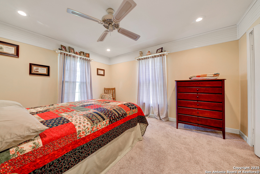 4190 Atkins Road Salado, TX 76571 - Photo 7 of 49 a bedroom with a bed and a ceiling fan