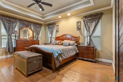 a bedroom with a bed couch and window