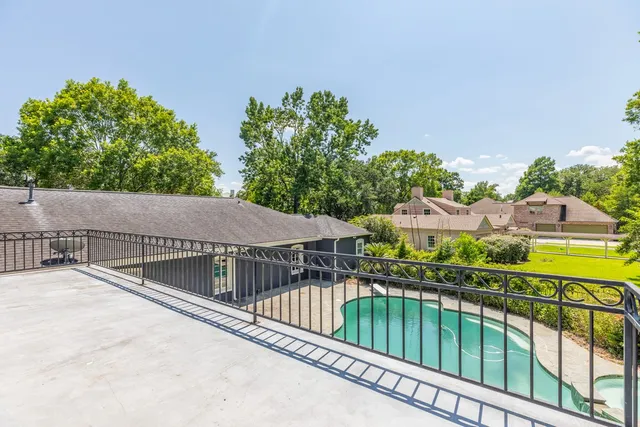 a view of balcony with small garden