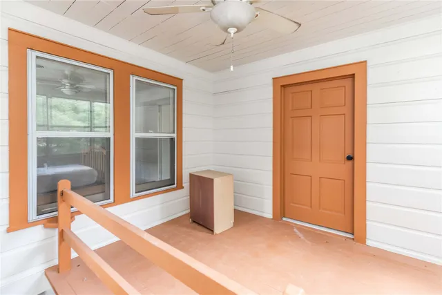 a view of an empty room with a window