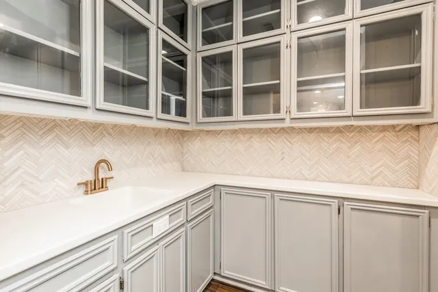 a view of a sink and cabinets