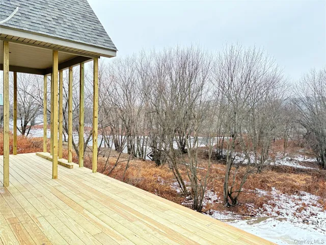 a bed sitting in a bedroom next to a large window