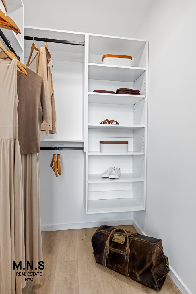 500 Degraw Street, Unit 2109 Brooklyn, NY 11217 - Photo 11 of 23 a view of walk in closet with clothes and shoes