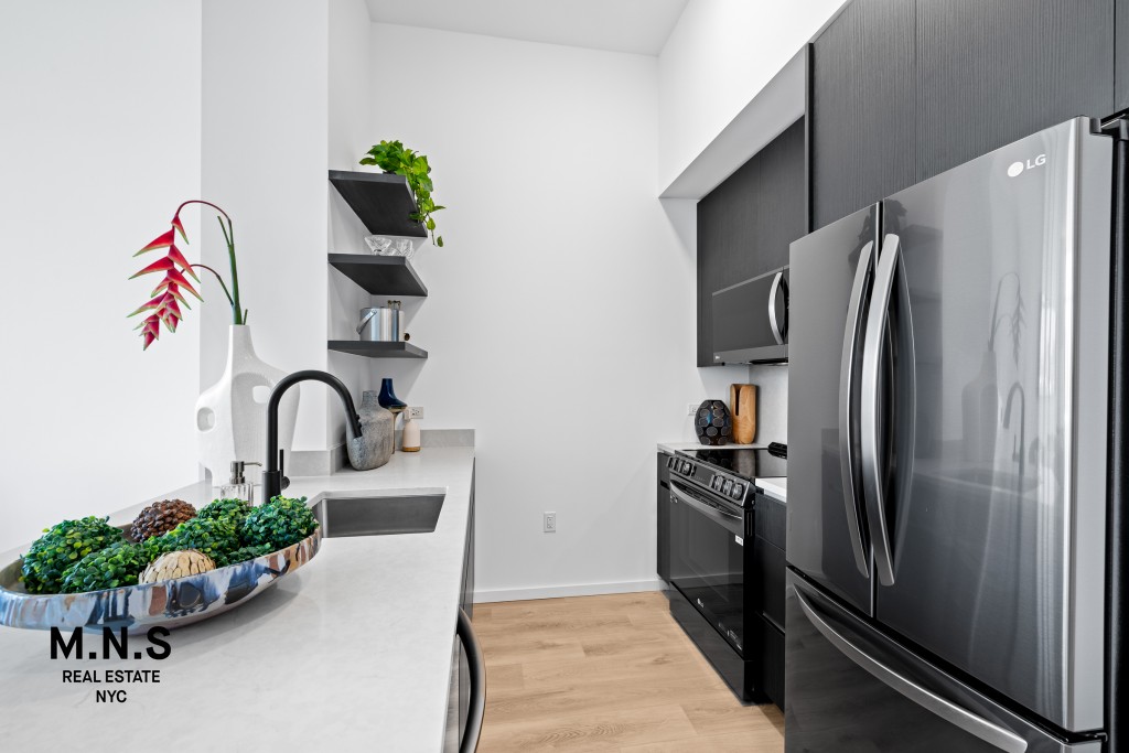 500 Degraw Street, Unit 2109 Brooklyn, NY 11217 - Photo 8 of 23 a kitchen with a refrigerator and a sink