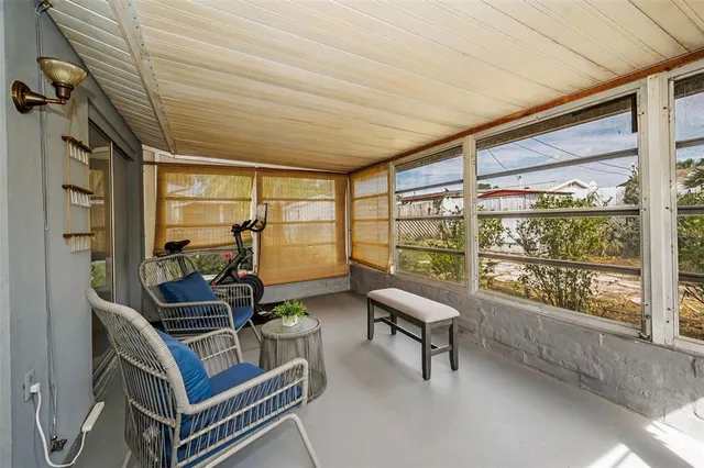 a room with gym equipment and a large window