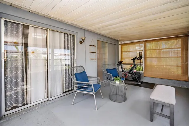 a room with lots of furniture and windows