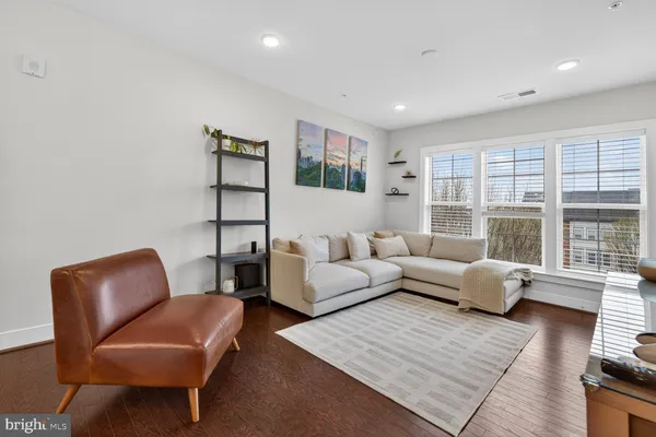a living room with furniture and windows