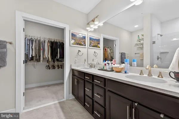 a bathroom with a sink a double vanity and a mirror