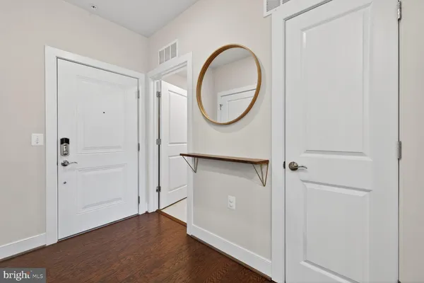 a view of a livingroom with wooden floor