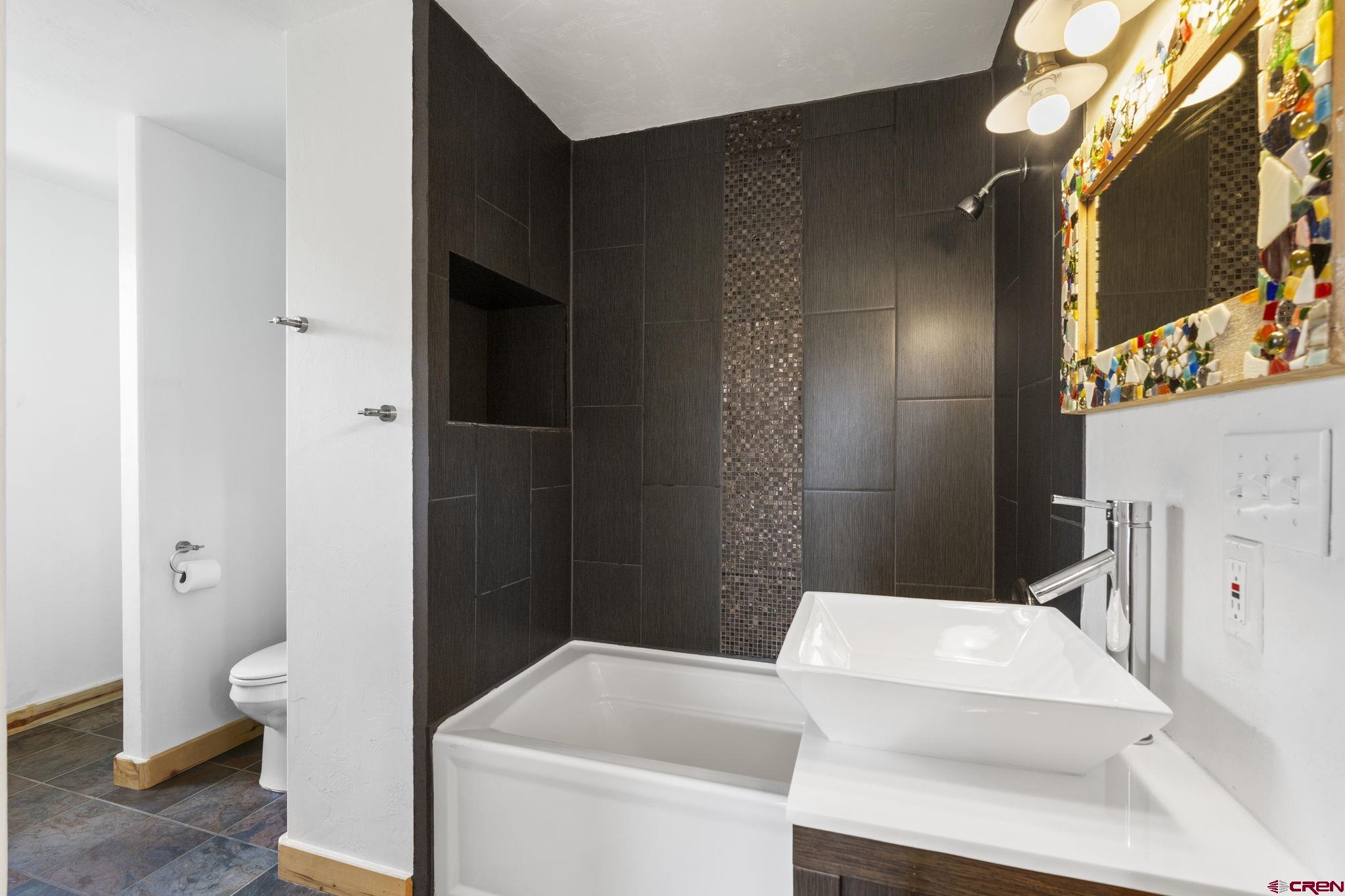 35510 Rd J.8 Mancos, CO 81328 - Photo 13 of 41 a bathroom with a sink a toilet and shower