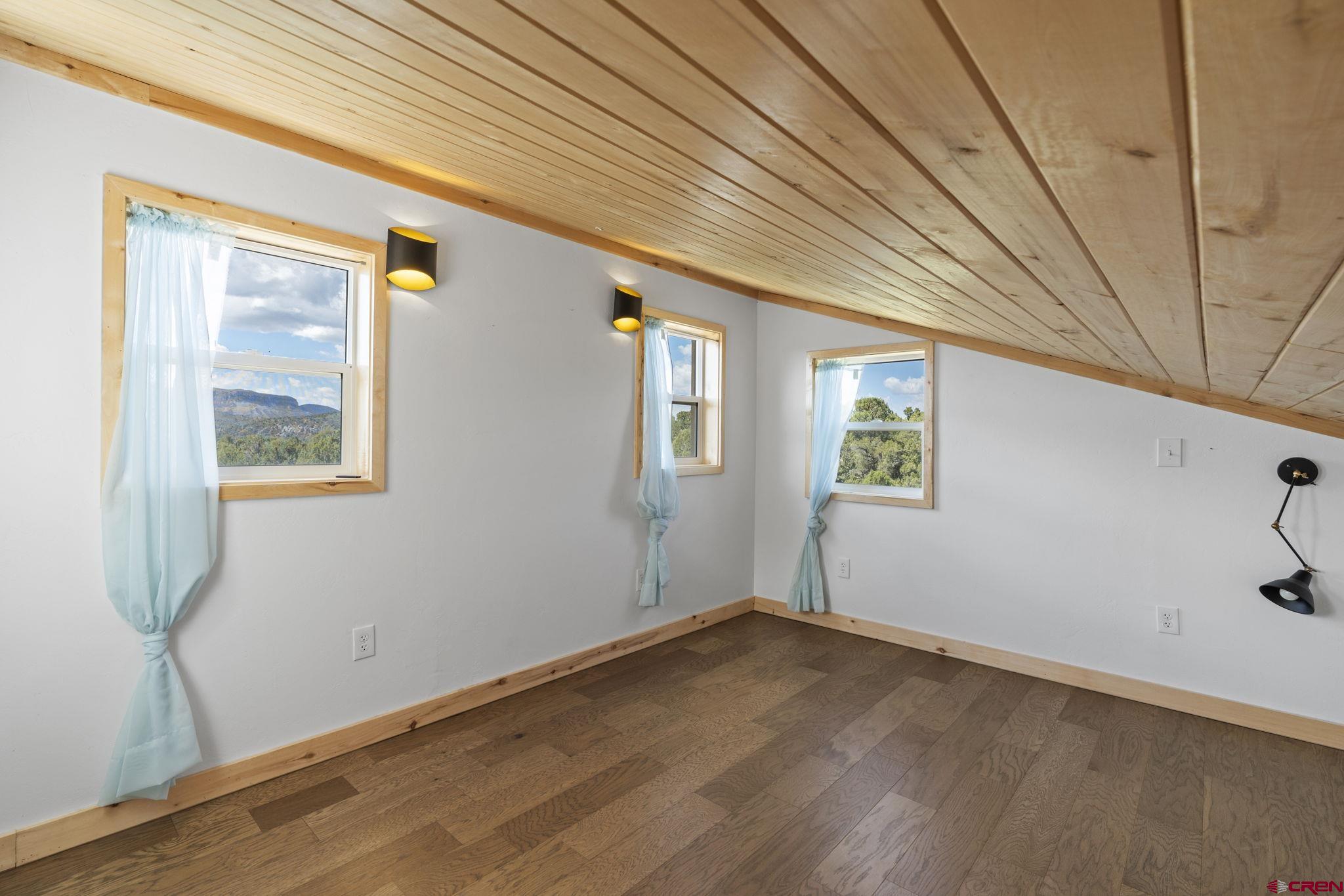35510 Rd J.8 Mancos, CO 81328 - Photo 15 of 41 a view of empty room with wooden floor