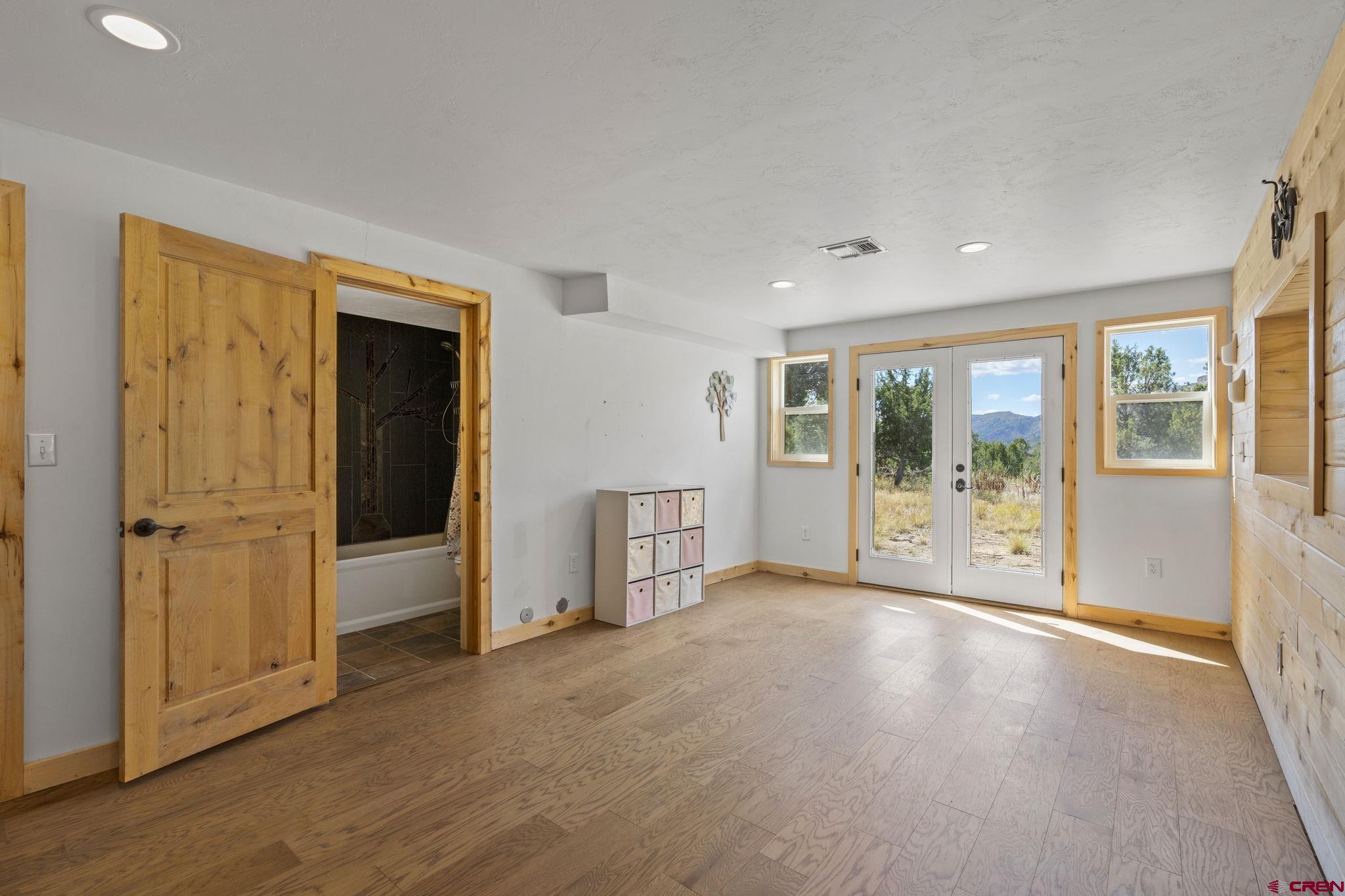 35510 Rd J.8 Mancos, CO 81328 - Photo 17 of 41 a view of an empty room with glass door and a window