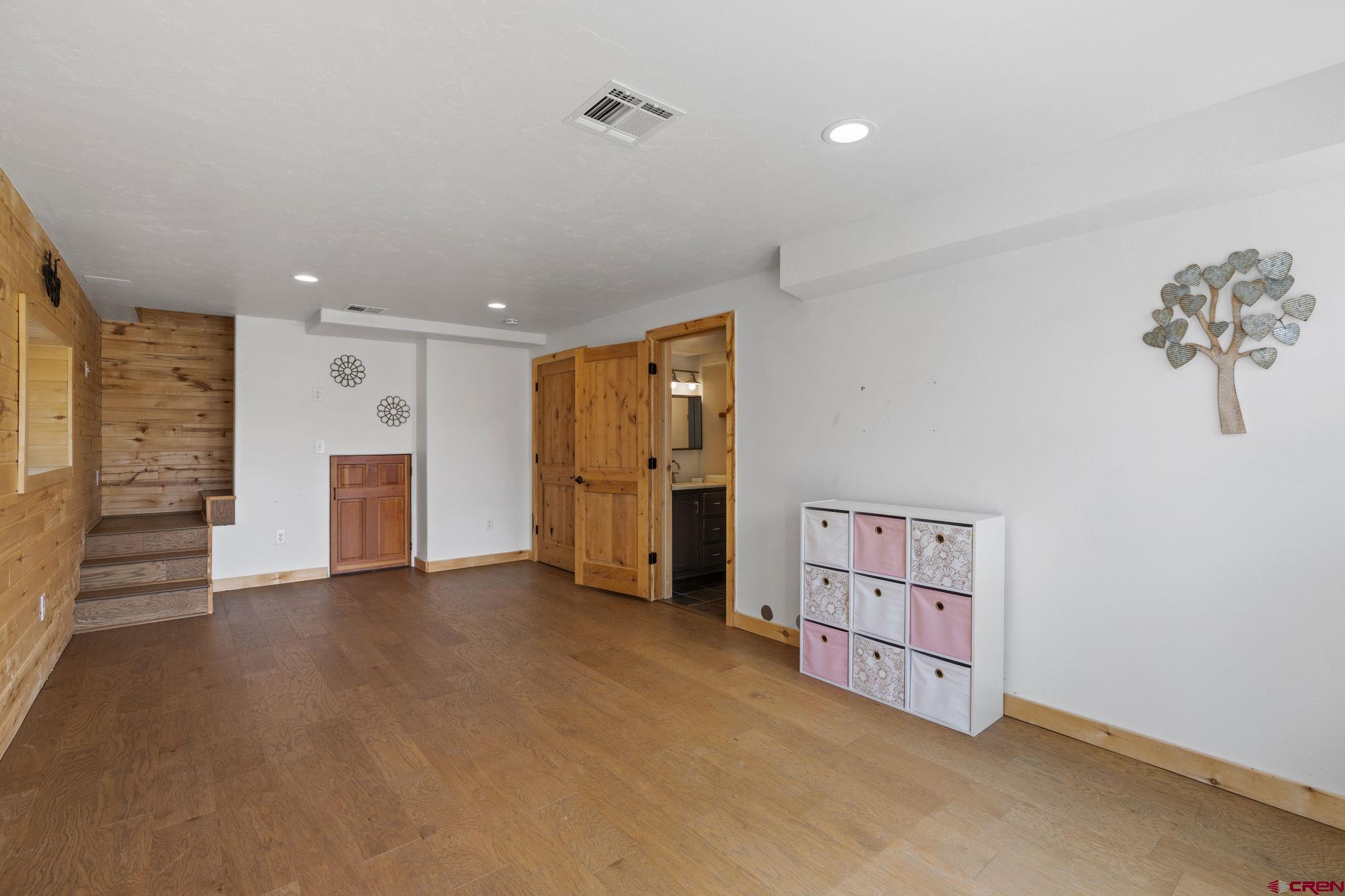 35510 Rd J.8 Mancos, CO 81328 - Photo 18 of 41 an empty room with a cabinet and mirrors