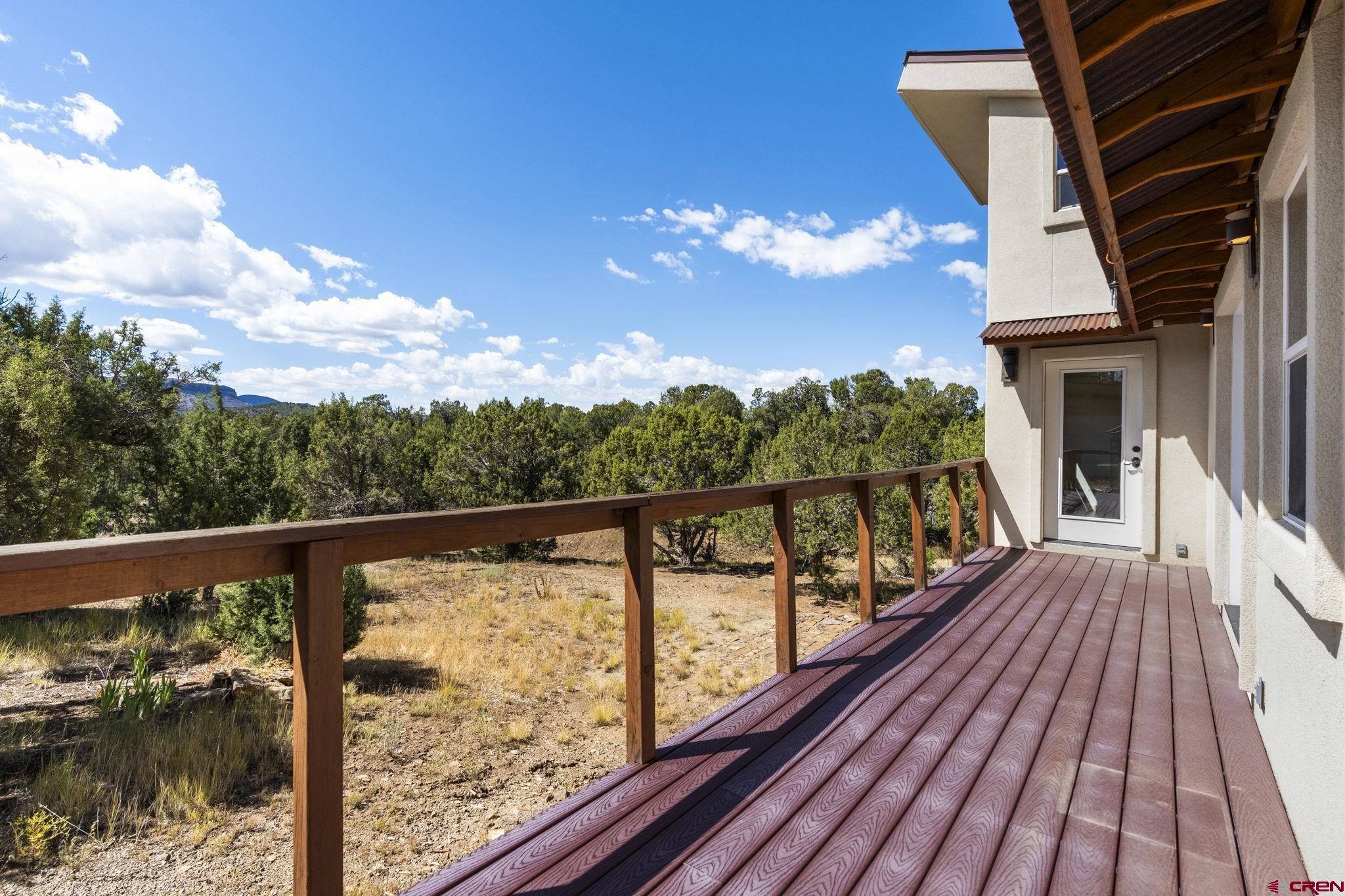 35510 Rd J.8 Mancos, CO 81328 - Photo 22 of 41 a view of balcony with wooden floor and fence