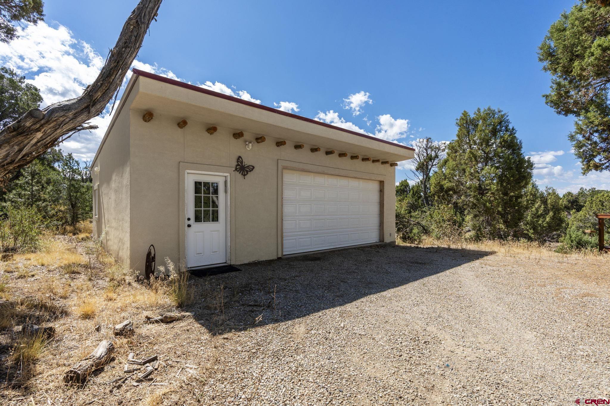 35510 Rd J.8 Mancos, CO 81328 - Photo 25 of 41 a view of a white house with a yard