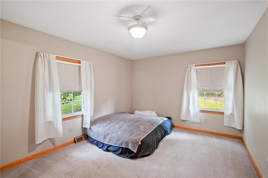 3766 North Balsiger Road Vandergrift, PA 15690 - Photo 15 of 34 a spacious bedroom with a bed and a window