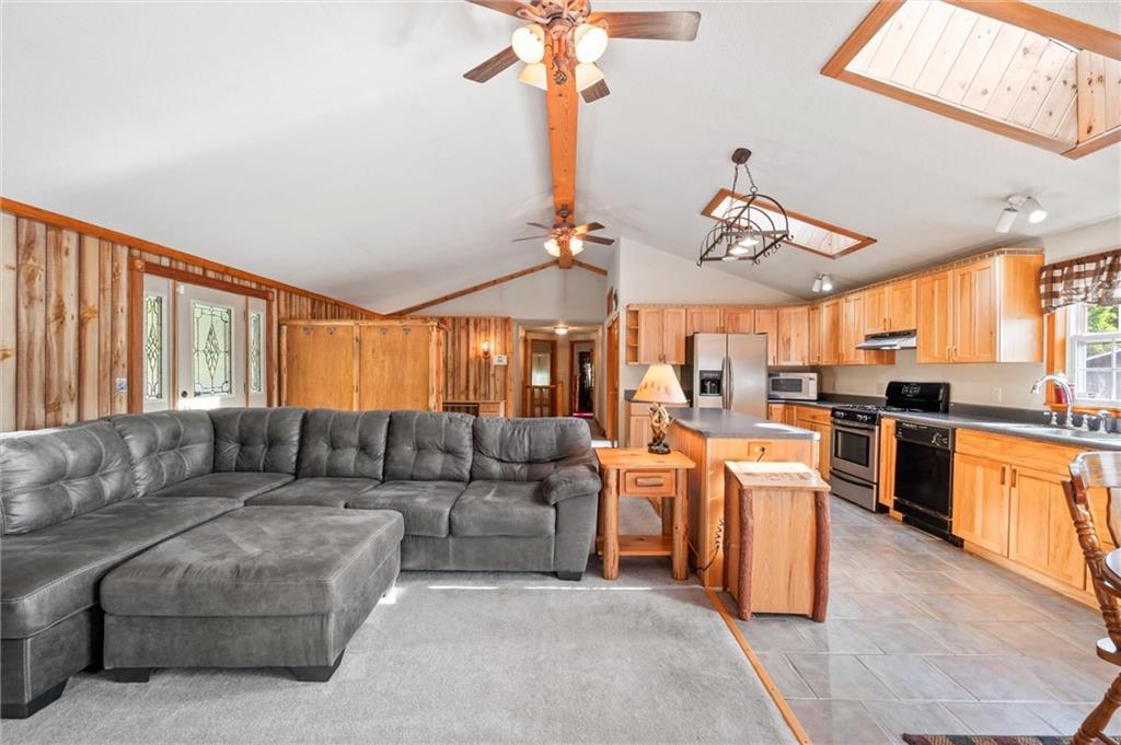 3766 North Balsiger Road Vandergrift, PA 15690 - Photo 6 of 34 a living room with furniture a chandelier and kitchen view
