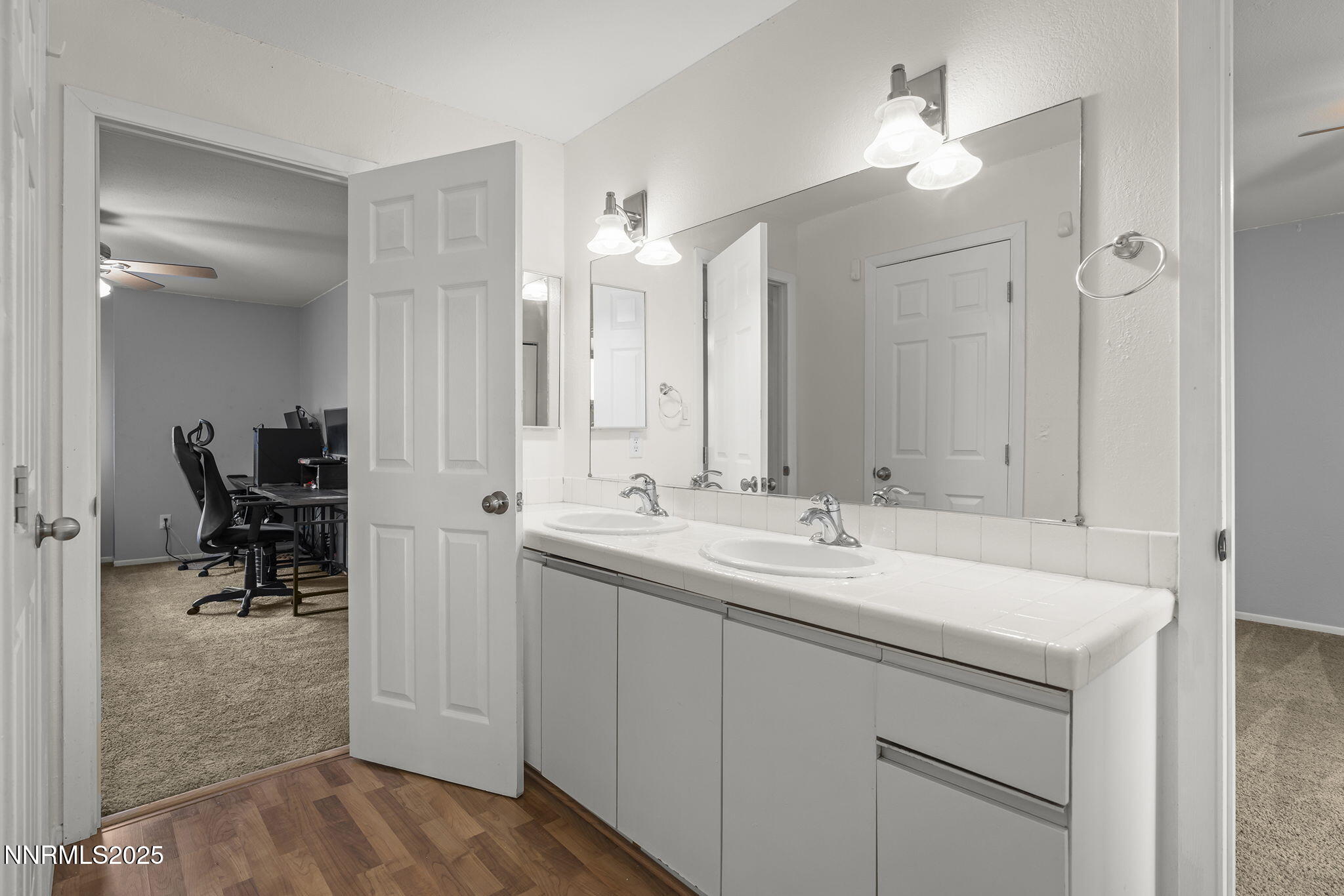 1023 Tyler Way Sparks, NV 89431 - Photo 18 of 21 a bathroom with a sink double vanity and a mirror